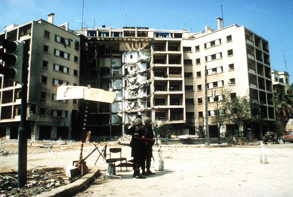 Two Marines stand in front of the US Embassy which was destroyed by a terrorist bomb attack in 1983