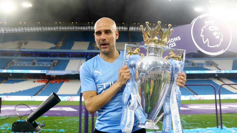 Pep Guardiola holds the Premier League trophy for the sixth time after Manchester City defeated Aston Villa