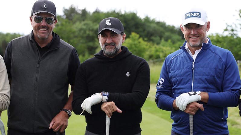 Phil Mickelson, left, and Lee Westwood, right, pose with Newcastle United chairman Yasir Al-Rumayyan before the inaugural LIV Golf Invitational
