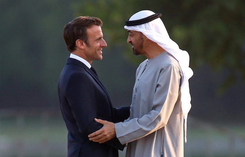 President Emmanuel Macron welcomes Sheikh Mohamed to a state dinner as French first lady Brigitte Macron looks on, at the Grand Trianon in Versailles