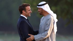 President Emmanuel Macron welcomes Sheikh Mohamed to a state dinner as French first lady Brigitte Macron looks on, at the Grand Trianon in Versailles