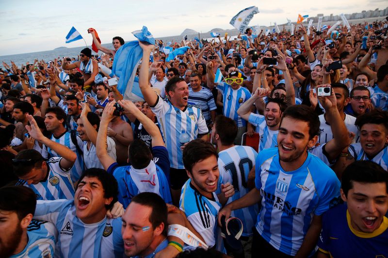 Argentina fans on Copacabana beach in Rio during the 2014 World Cup. Visiting fans represented 0.7% of the population in Brazil. For Qatar, the percentage will be far higher
