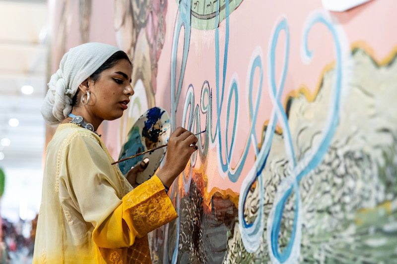 Young artists paint a wall at the Youth and Children Pavilion at Cop27 in Sharm El Sheikh, Egypt. A draft deal was published on Thursday