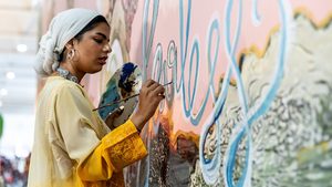 Young artists paint a wall at the Youth and Children Pavilion at Cop27 in Sharm El Sheikh, Egypt. A draft deal was published on Thursday