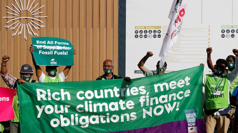 Activists demonstrate at the Sharm El Sheikh International Convention Centre during Cop27