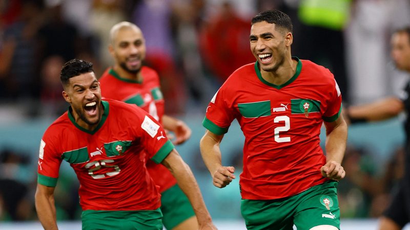 Morocco's Achraf Hakimi celebrates after scoring the winning penalty against Spain at Qatar 2022