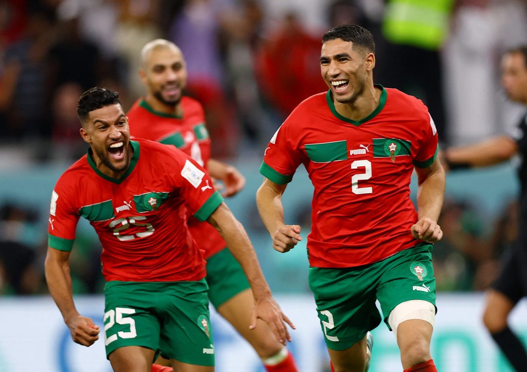 Morocco's Achraf Hakimi celebrates after scoring the winning penalty against Spain at Qatar 2022