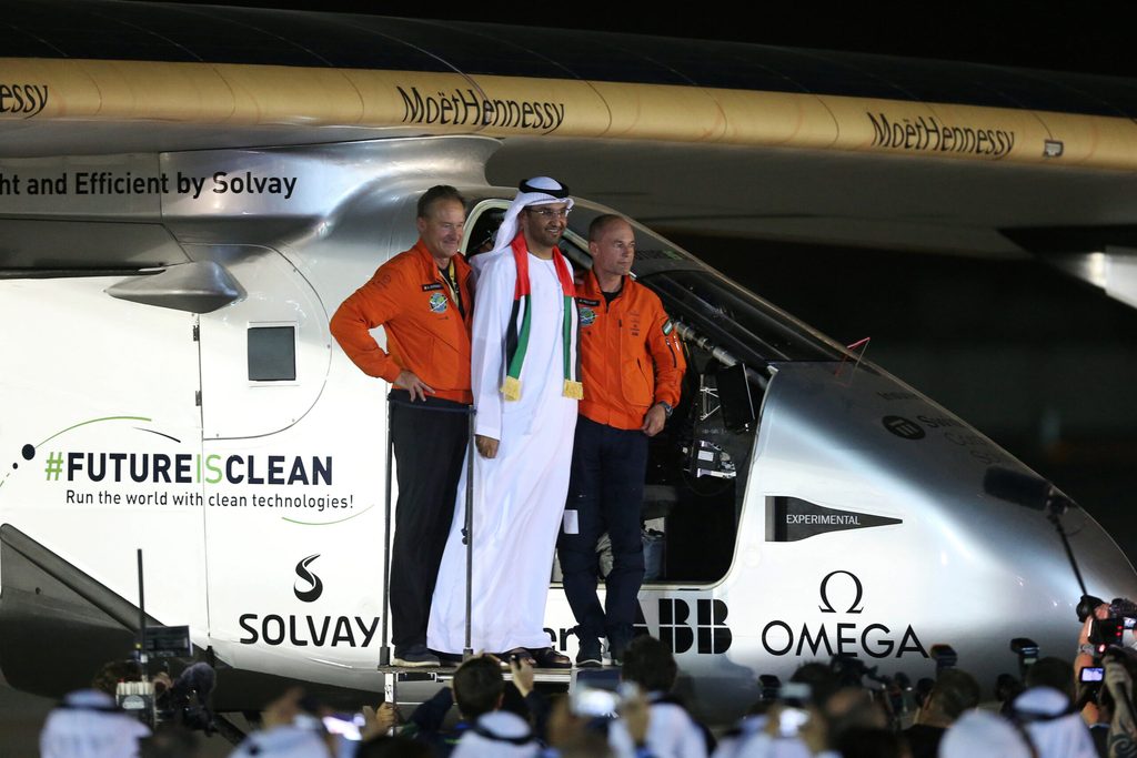 Sultan Al Jaber meets pilots Andre Borschberg and Bertrand Piccard after the solar-powered plane Solar Impulse landed in Abu Dhabi on July 26, 2016. Al Jaber remains chairman of renewables specialist Masdar