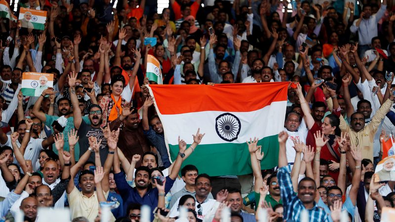 Indians in Bahrain wave flags as they wait for Narendra Modi, India's PM, at Bahrain National Stadium in Manama. More than half of Indian expats live in GCC states