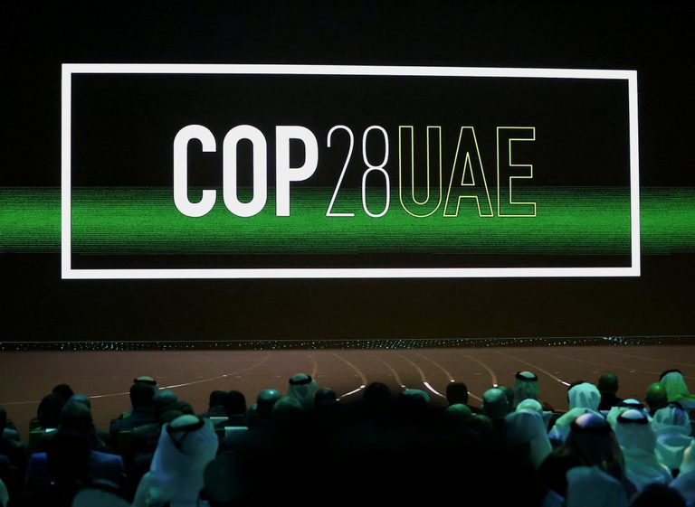 The "Cop28 UAE" logo is displayed at Abu Dhabi Sustainability Week on January 16