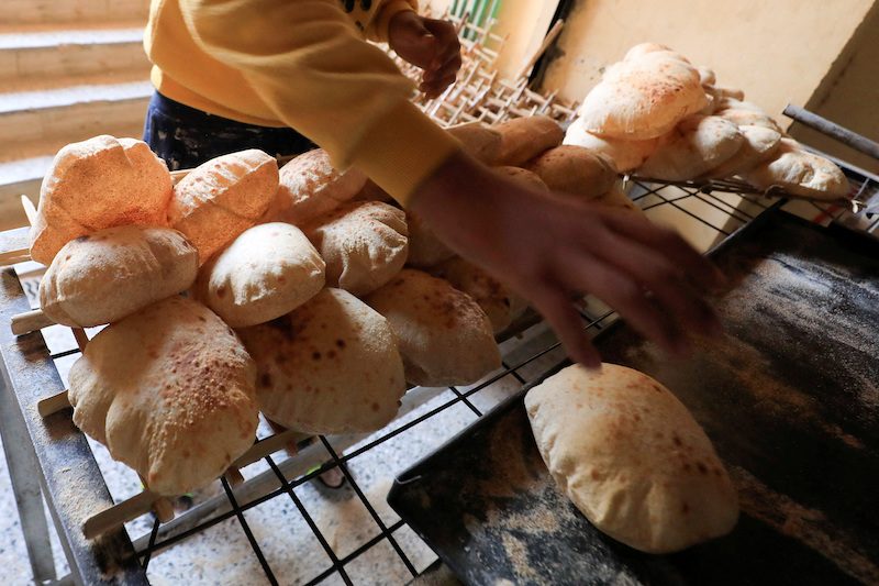 Making bread at a bakery in Cairo. Grain and bread prices fell by 0.6 percent month-on-month