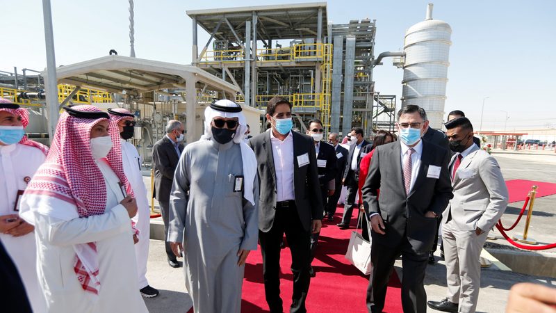 Halliburton's president and CEO Jeff Miller and Aramco's senior vice president of upstream Nasir Al-Naimi arrive for a ceremony to inaugurate the first Halliburton Chemical Reaction Plant in Saudi Arabia