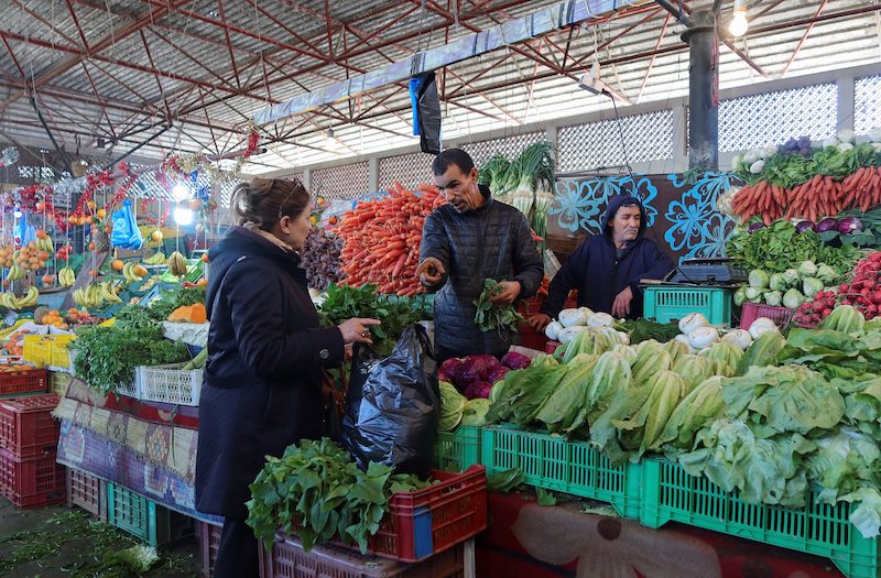 A woman shops at a fruit and vegetable market in Tunis. In June Tunisia was given a rating of CCC-, which is seven levels below investment grade