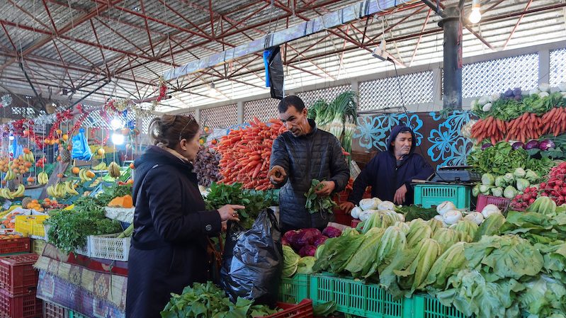 A woman shops at a fruit and vegetable market in Tunis. In June Tunisia was given a rating of CCC-, which is seven levels below investment grade