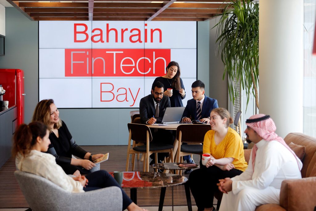 Bahrain FinTech Bay is seen as staff chat in its office in Bahrain Bay, Manama, Bahrain