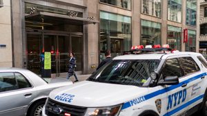 A New York City Police vehicle is parked in front of the Park Avenue branch of Silicon Valley Bank in the US