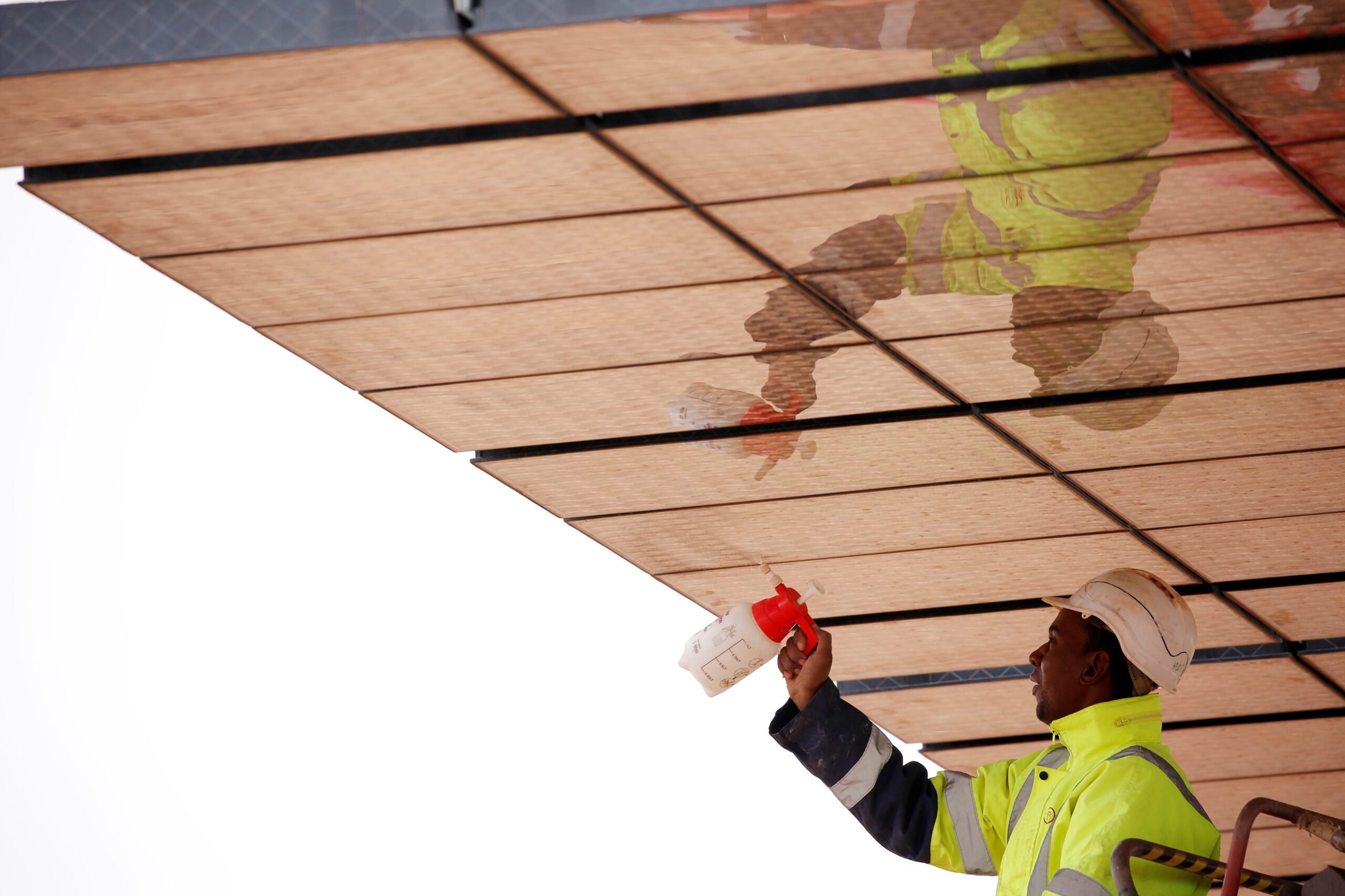 man cleaning solar panels