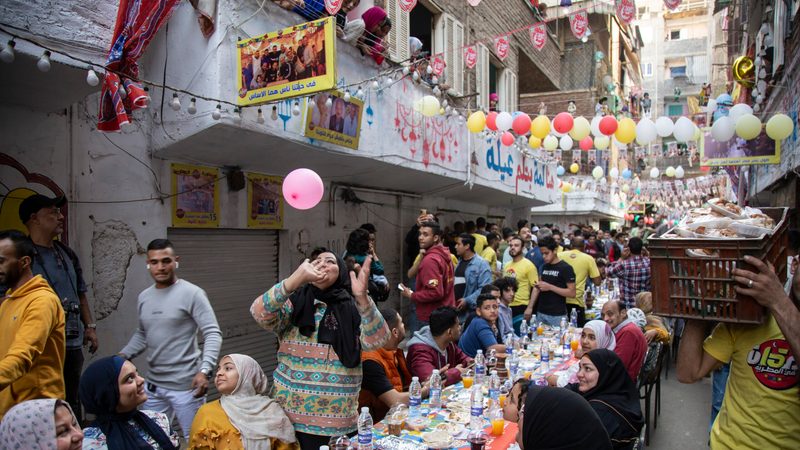 Residents of the Matareya district of Cairo break their Ramadan fast on April 6. Food prices have risen sharply in Egypt