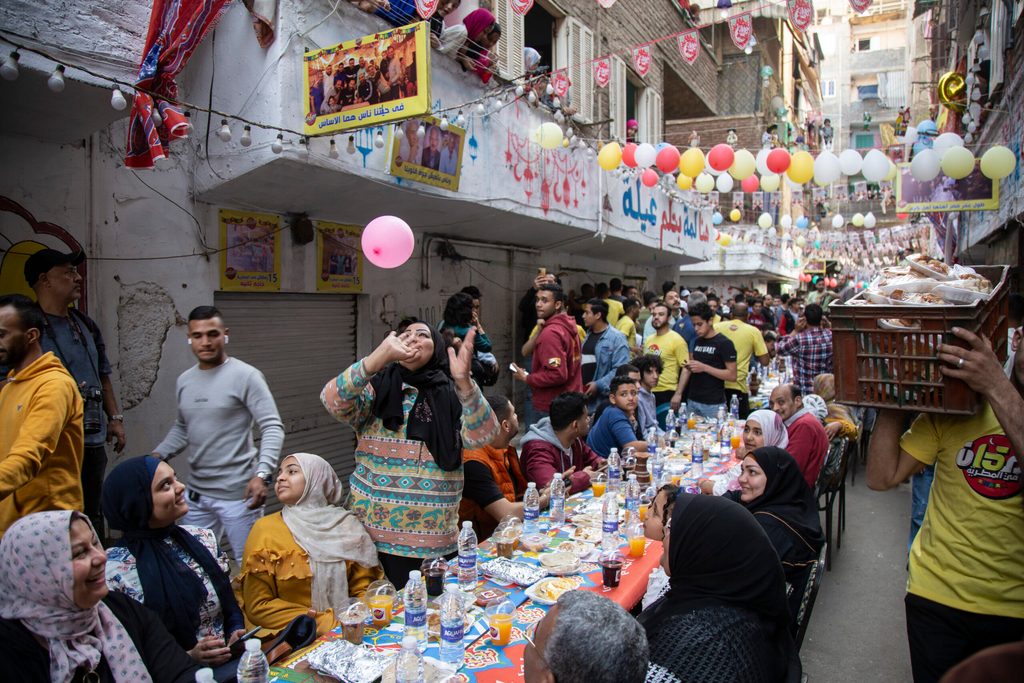 Residents of the Matareya district of Cairo break their Ramadan fast on April 6. Food prices have risen sharply in Egypt