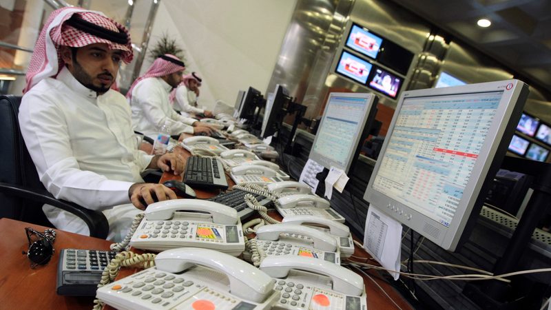 Saudi office workers with jobs on stock exchange