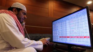 A trader monitors stocks at the Saudi stock market in Riyadh. Saudi banking stocks are slumping despite steady earnings