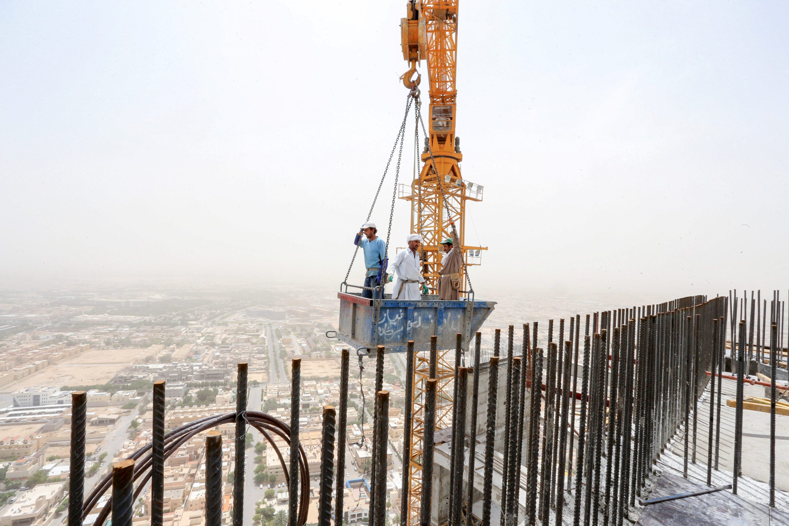 Workers on a construction site in Riyadh GCC