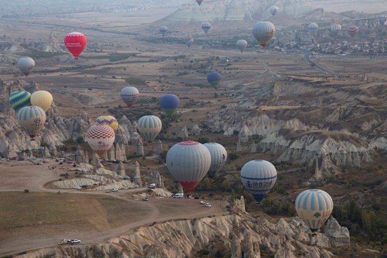 Hot air balloons hover over Goreme, in the Cappadocia region of Turkey. The country had more than 50 million international visitors in 2022
