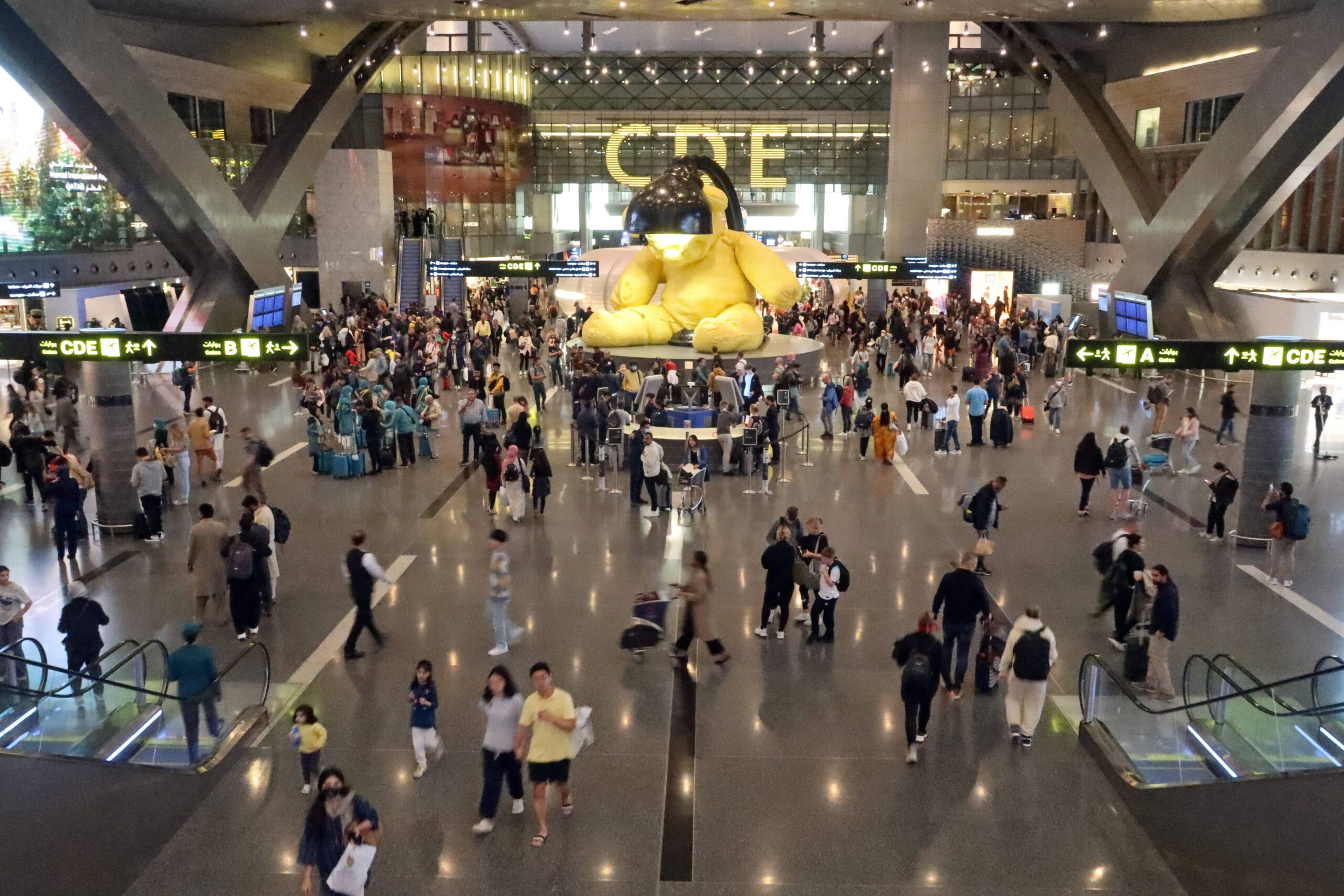 Passengers at Doha airport in Qatar. Direct flights to Bahrain will restart on May 25