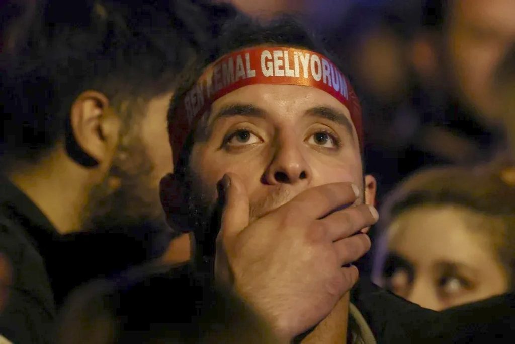 A supporter of Kemal Kılıçdaroğlu, presidential candidate of Turkey’s main opposition alliance, awaits the election results