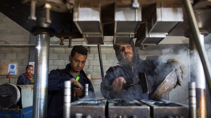 Workers at an Egyptian startup producing tiles from recycled materials. S&P's PMI for May reported a near-stabilisation in manufacturing