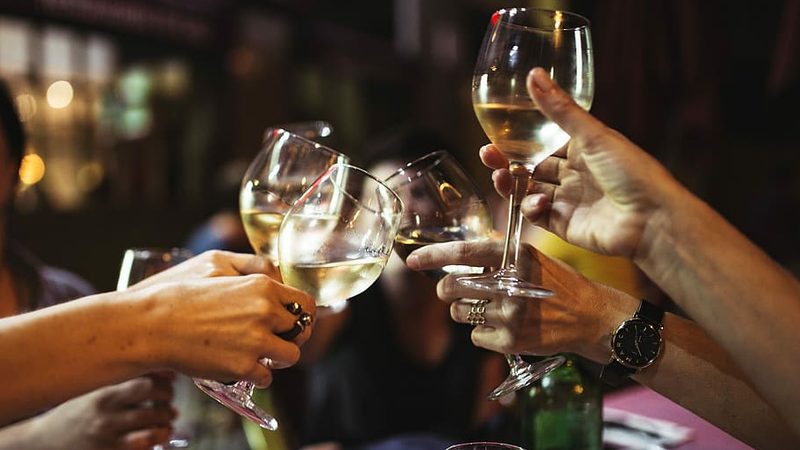 Tongues loosen as the drinks flow at the "hacks" and "flacks" get together