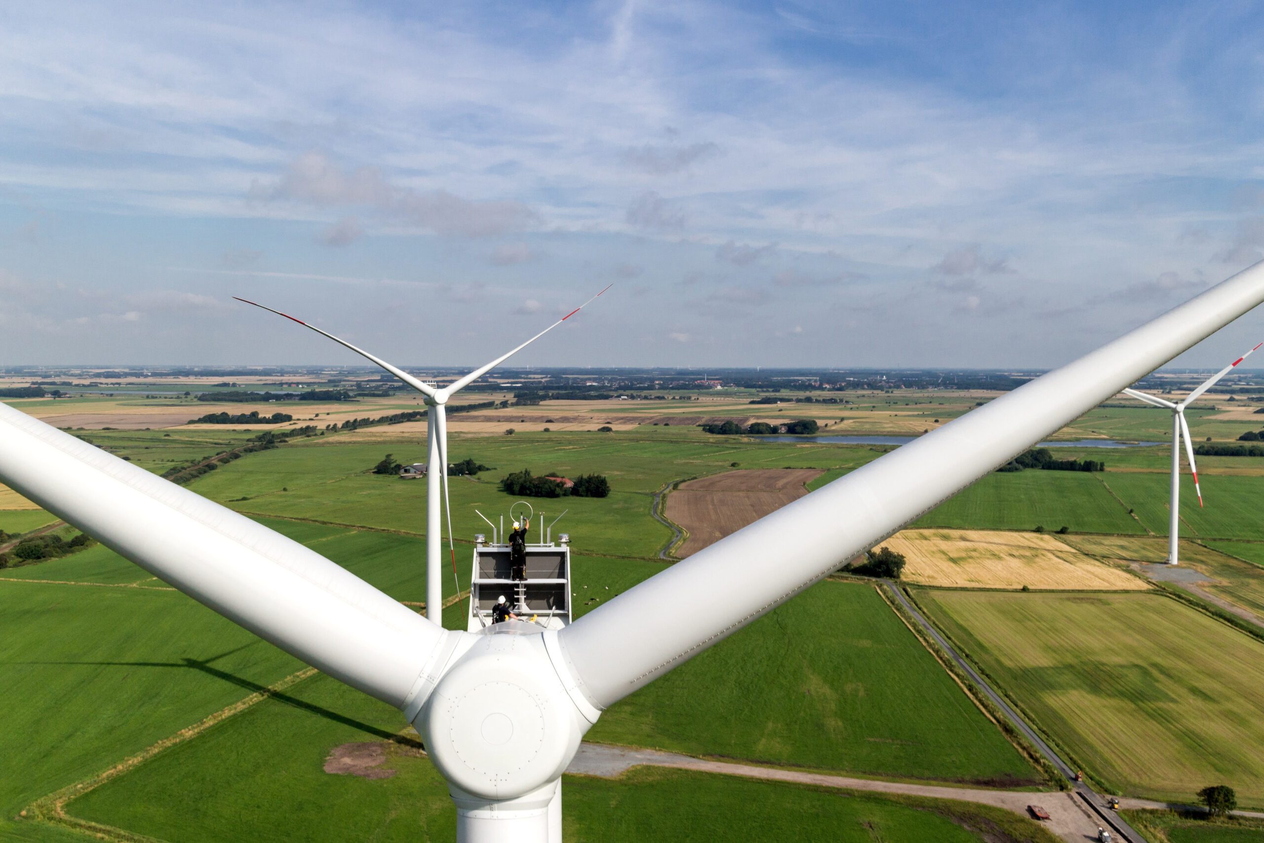 Technicians work on a turbine. Masdar's wind farm will help Kazakhstan meet its 50% renewables target for 2050