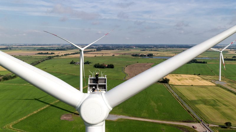 Technicians work on a turbine. Masdar's wind farm will help Kazakhstan meet its 50% renewables target for 2050