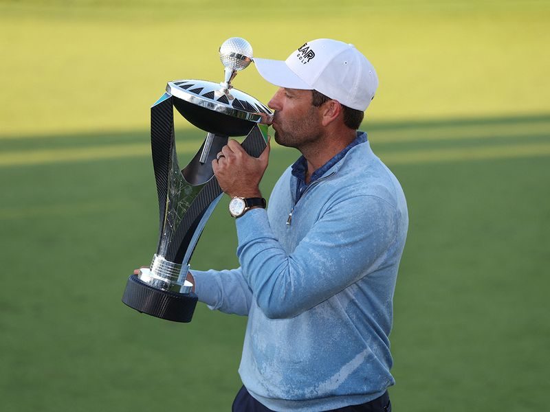 South Africa's Charl Schwartzel of the Stinger team celebrates with the trophy after winning the inaugural LIV Golf Invitational