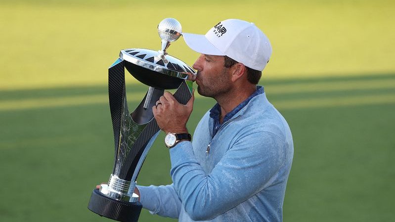 South Africa's Charl Schwartzel of the Stinger team celebrates with the trophy after winning the inaugural LIV Golf Invitational