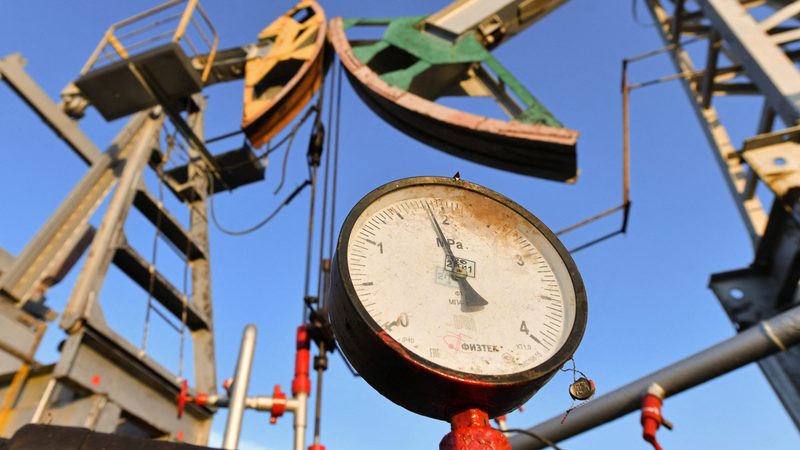 A pressure gauge and oil pump jacks outside Almetyevsk in Tatarstan, Russia. Oil ministers and executives will attend the Opec seminar that starts on Wednesday