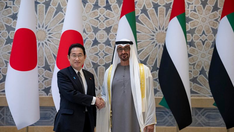 Japanese premier Fumio Kishida greets the UAE's president, Sheikh Mohamed bin Zayed, in Abu Dhabi on Monday