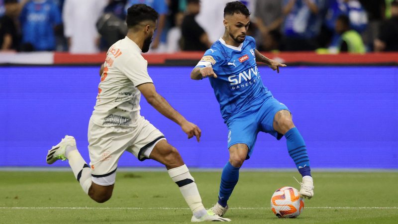 Saudi Pro League footbal - Al-Feiha's Mohammed Al Baqawi in action with Al-Hilal's Michael