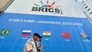 Soldiers walk past the Sandton Convention Centre, north of Johannesburg, which will host the Brics summit