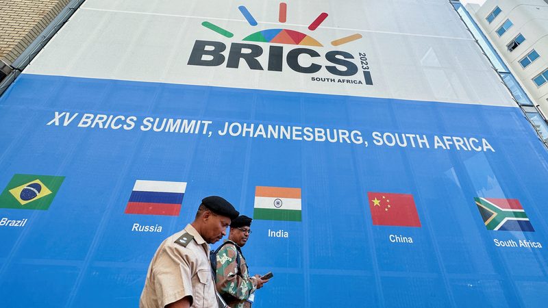 Soldiers walk past the Sandton Convention Centre, north of Johannesburg, which will host the Brics summit