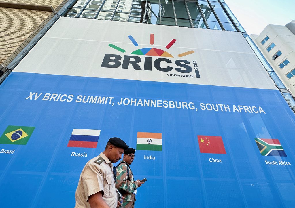 Soldiers walk past the Sandton Convention Centre, north of Johannesburg, which will host the Brics summit