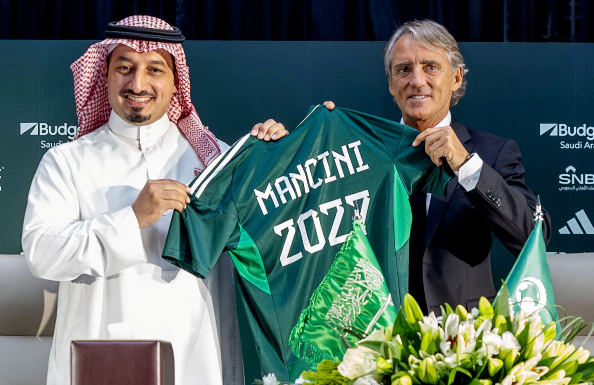 Roberto Mancini poses with Yasser Al Misehal, president of the Saudi Arabia Football Federation, as he is unveiled as the national team's head coach