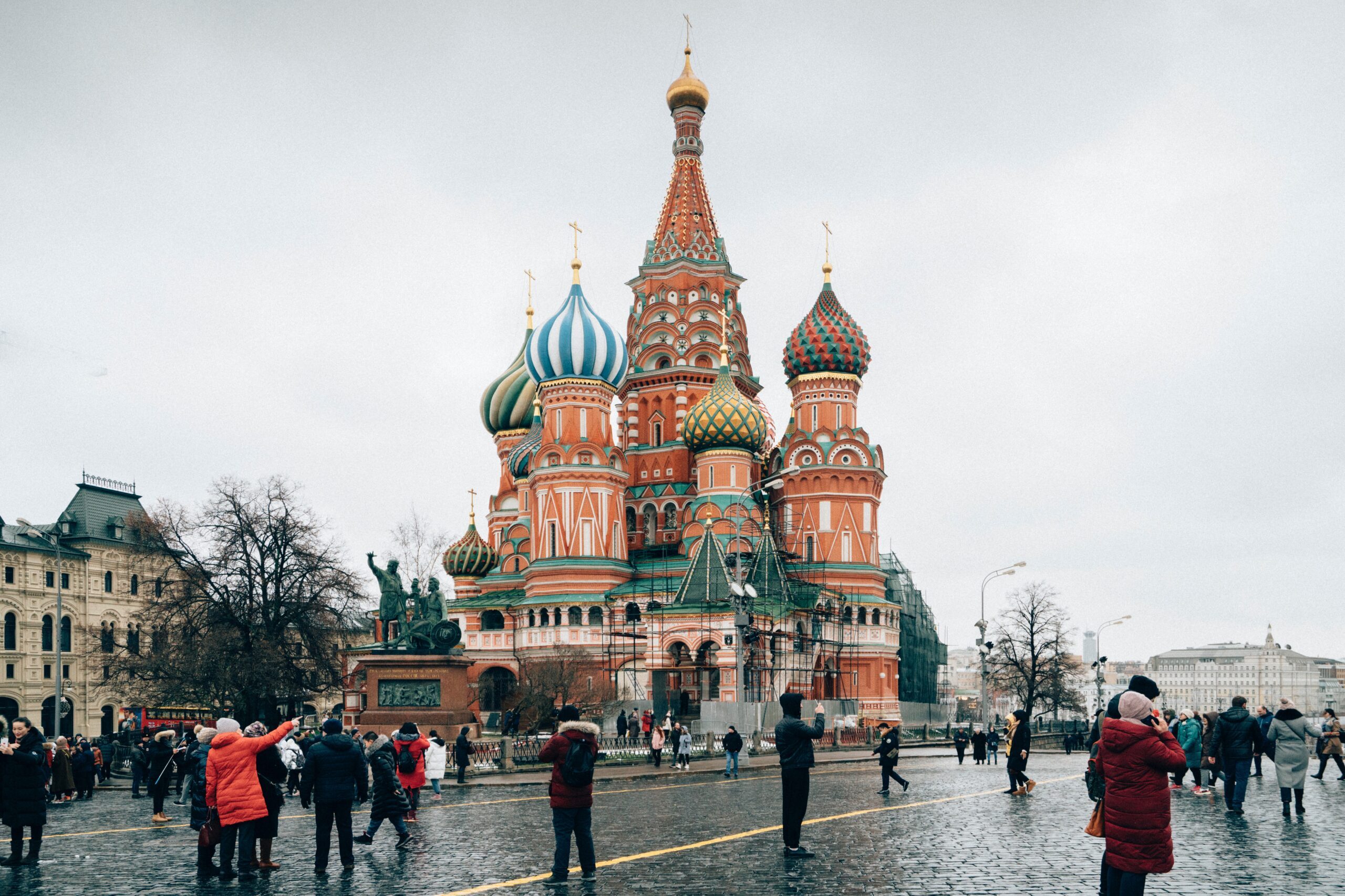 Tourists and residents in Red Square, Moscow, Russia - St Basil's Cathedral is visible