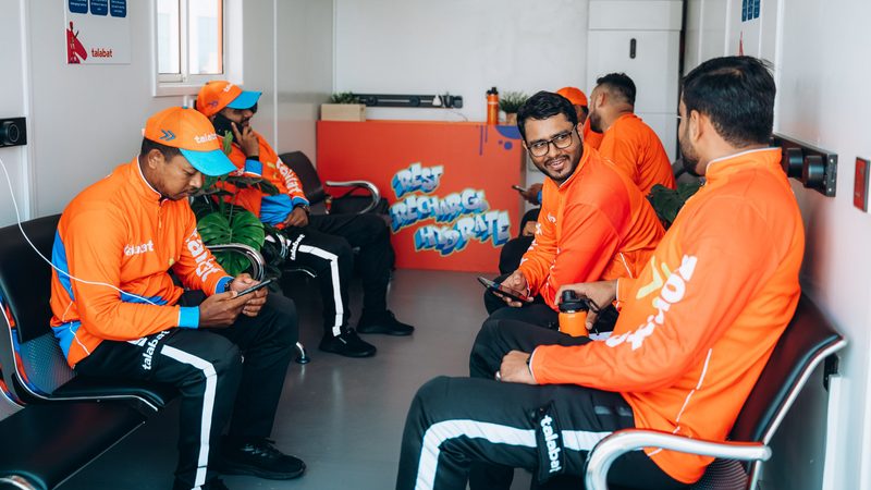 Talabat delivery drivers at a rest station. The company is owned by German conglomerate Delivery Hero