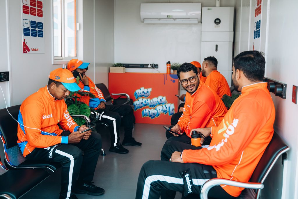 Talabat delivery drivers at a rest station. The company is owned by German conglomerate Delivery Hero