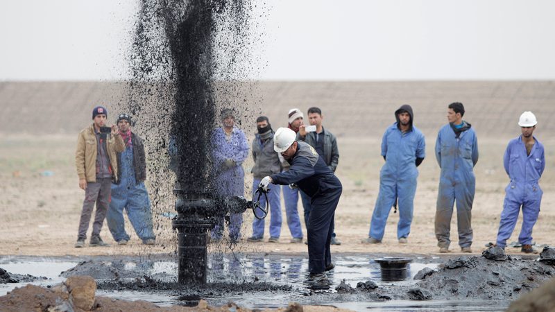 Iraqi oil workers at the Al Tuba field in Basra. The IEA believes the rise of competitive alternatives to fossil fuels will reverse demand