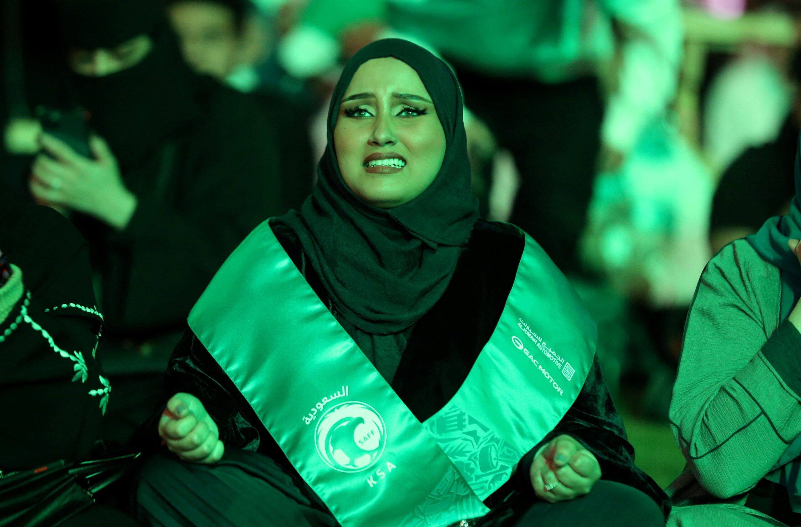 A fan watches the Saudi national side take on Mexico in the 2022 World Cup. Thousands of Saudi Arabians visited Qatar for matches