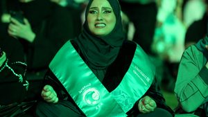 A fan watches the Saudi national side take on Mexico in the 2022 World Cup. Thousands of Saudi Arabians visited Qatar for matches