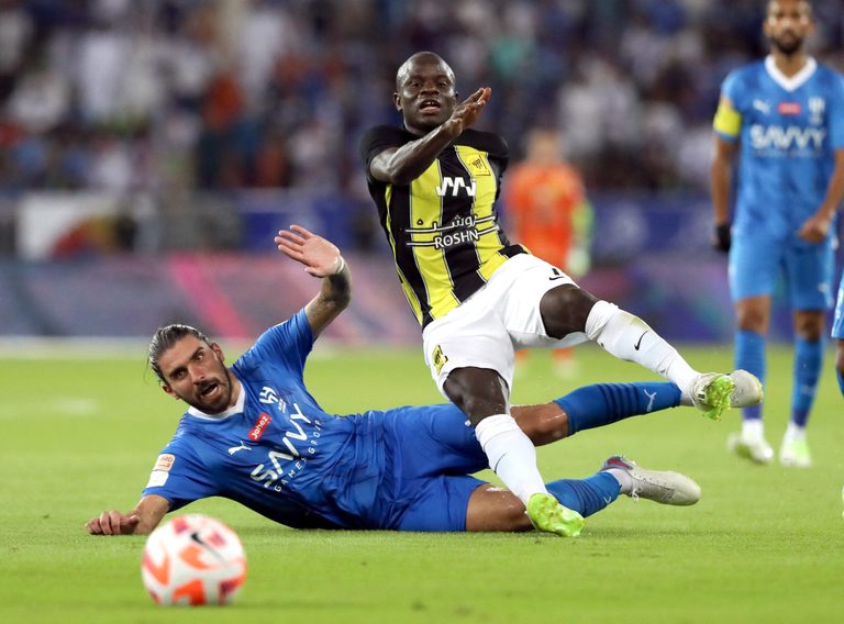 Al Hilal's Ruben Neves challenges Al Ittihad's N'Golo Kante. Both moved to Saudi Arabia from the Premier League