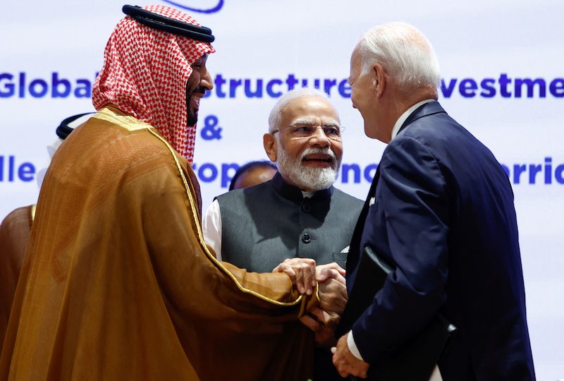 Saudi Crown Prince Mohammed bin Salman Al Saud, US President Joe Biden and Indian Prime Minister Narendra Modi shake hands at the G20 summit in New Delhi